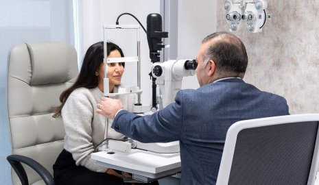 OCL consultant testing a patient's eyes